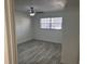 Bright bedroom featuring wood-look tile flooring and ample natural light at 4505 3Rd Street W Cir # 269, Bradenton, FL 34207