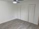 Bedroom with spacious closet, ceiling fan, and wood-look tile flooring at 4505 3Rd Street W Cir # 269, Bradenton, FL 34207
