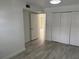 Bedroom featuring wood-look tile flooring and closet at 4505 3Rd Street W Cir # 269, Bradenton, FL 34207
