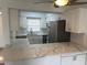 Modern kitchen with white cabinets, quartz countertops, and stainless steel appliances at 4505 3Rd Street W Cir # 269, Bradenton, FL 34207