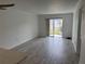 Spacious living room featuring wood-look tile flooring and sliding glass doors at 4505 3Rd Street W Cir # 269, Bradenton, FL 34207