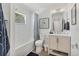 Clean bathroom featuring a shower-tub, vanity, and a framed picture for added style at 4911 Commonwealth Rd, Palmetto, FL 34221