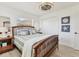 Inviting bedroom featuring a wooden bed frame, stylish decor, and a closet for ample storage at 4911 Commonwealth Rd, Palmetto, FL 34221