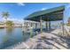 Covered boat dock with a boat lift and access to the canal at 4911 Commonwealth Rd, Palmetto, FL 34221