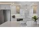 Updated kitchen featuring white cabinetry, stainless appliances, and modern countertops at 4911 Commonwealth Rd, Palmetto, FL 34221