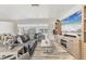 Cozy living room featuring stylish furniture, a large flat-screen TV, and a comfortable layout for relaxation and entertainment at 4911 Commonwealth Rd, Palmetto, FL 34221