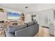 Comfortable living room with a large TV, neutral decor, and access to the entryway, perfect for modern living at 4911 Commonwealth Rd, Palmetto, FL 34221