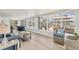 Bright sunroom with pool view, plenty of seating and natural light creates a relaxing space at 4911 Commonwealth Rd, Palmetto, FL 34221