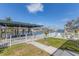 Waterfront view from the property with a patio and boat dock at 4911 Commonwealth Rd, Palmetto, FL 34221