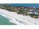 Picturesque aerial view of the beachfront community with sandy shoreline and crystal-clear waters at 5055 Gulf Of Mexico Dr # 435, Longboat Key, FL 34228