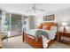 This cozy bedroom features a queen size bed and a large balcony offering stunning water views at 5055 Gulf Of Mexico Dr # 435, Longboat Key, FL 34228