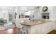 Well-lit kitchen with stainless appliances, ample counter space, and direct access to an outdoor balcony at 5055 Gulf Of Mexico Dr # 435, Longboat Key, FL 34228