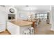 Inviting living space with dining area and balcony access, offering a seamless indoor-outdoor living experience at 5055 Gulf Of Mexico Dr # 435, Longboat Key, FL 34228