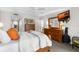 Comfortable main bedroom featuring wood furniture, a ceiling fan, and neutral carpeting and paint at 5055 Gulf Of Mexico Dr # 435, Longboat Key, FL 34228
