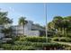 Sign for the Club Longboat community landscaped with palm trees and shrubbery at 5055 Gulf Of Mexico Dr # 435, Longboat Key, FL 34228