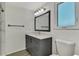 Bathroom featuring a gray vanity with quartz countertops, modern lighting and fixtures at 510 S Venice Blvd, Venice, FL 34293