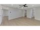 Spacious bedroom with wood floors, ceiling fan, and ensuite bathroom at 510 S Venice Blvd, Venice, FL 34293