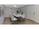 Staged dining room with a marble top table with six chairs at 510 S Venice Blvd, Venice, FL 34293