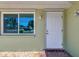 Close up of the front door and window to the left of the door at 510 S Venice Blvd, Venice, FL 34293