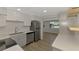 Bright kitchen features white cabinets, stainless steel appliances, and quartz countertops at 510 S Venice Blvd, Venice, FL 34293