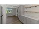 Eat-in kitchen with breakfast bar area and backyard view at 510 S Venice Blvd, Venice, FL 34293