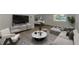 Staged living room with modern decor, featuring a large couch, chairs, and marble coffee table at 510 S Venice Blvd, Venice, FL 34293
