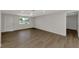 Spacious living room with hardwood floors and a modern ceiling fan at 510 S Venice Blvd, Venice, FL 34293