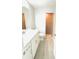 Modern bathroom featuring a vanity, toilet, and tiled walk-in shower at 5113 Rilke Ln, Port Charlotte, FL 33981