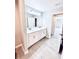 Elegant bathroom with double vanity, marble countertops, and stylish tile flooring at 5113 Rilke Ln, Port Charlotte, FL 33981