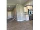 Modern kitchen with white cabinets, stainless steel appliances, and sleek tile flooring at 5113 Rilke Ln, Port Charlotte, FL 33981