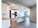 Open kitchen with an island and stainless steel appliances flows into the dining area at 5113 Rilke Ln, Port Charlotte, FL 33981