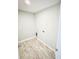 Compact laundry room with modern light wood flooring and essential hookups for a washer and dryer at 5113 Rilke Ln, Port Charlotte, FL 33981