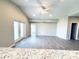 Bright living room with tile floors, ceiling fan, and sliding glass doors at 5113 Rilke Ln, Port Charlotte, FL 33981