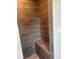 Tiled shower stall with a built-in seat and decorative stone flooring at 5113 Rilke Ln, Port Charlotte, FL 33981