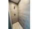 Modern walk-in shower featuring stylish tile walls, dual shower heads, and a mosaic pebble floor at 5113 Rilke Ln, Port Charlotte, FL 33981