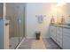 Bathroom features glass-enclosed shower, granite counters, and double sinks at 5252 Bentgrass Way, Bradenton, FL 34211