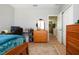 Bedroom with wood floors, neutral paint, and a closet at 5252 Bentgrass Way, Bradenton, FL 34211