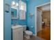 Bright blue bathroom with a tiled floor and a vanity with a sink at 5603 90Th Avenue E Cir, Parrish, FL 34219