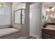 Relaxing bathroom with soaking tub, walk-in shower, and vanity at 5603 90Th Avenue E Cir, Parrish, FL 34219