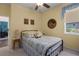 Comfortable bedroom features a window with natural light and a view and cozy decor at 5603 90Th Avenue E Cir, Parrish, FL 34219