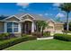 A well-manicured lawn and landscaping with front entrance to a lovely one-story home at 5603 90Th Avenue E Cir, Parrish, FL 34219