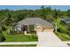 Beautiful home with well-manicured landscaping, a double garage, and a neatly paved driveway at 5603 90Th Avenue E Cir, Parrish, FL 34219