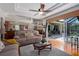 Spacious living room with hardwood floors, ceiling fan and opening to the outdoor patio at 5603 90Th Avenue E Cir, Parrish, FL 34219