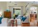 Inviting living room with vaulted ceilings and sliding glass doors leading to a screened-in patio and pool at 5603 90Th Avenue E Cir, Parrish, FL 34219