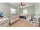 A bedroom features a bunk bed, crib, and ample space for playing and learning at 5732 Beneva Rd, Sarasota, FL 34233