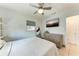 Comfortable bedroom with a large bed, dresser, and TV for relaxation and enjoyment at 5732 Beneva Rd, Sarasota, FL 34233