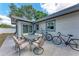 Outdoor patio with a seating area and bicycles near the house at 5732 Beneva Rd, Sarasota, FL 34233