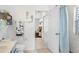 Bathroom featuring sea-themed decorations leading into a bedroom with hardwood bed frame at 5915 43Rd E Ct, Bradenton, FL 34203