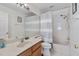 Well-lit bathroom featuring a shower-tub combo and a light wood vanity at 5915 43Rd E Ct, Bradenton, FL 34203