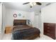 Cozy bedroom with hardwood bed frame, art, and matching bedside tables and dressers at 5915 43Rd E Ct, Bradenton, FL 34203